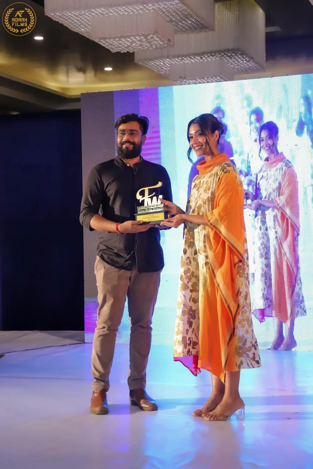 Award presentation at a professional design event