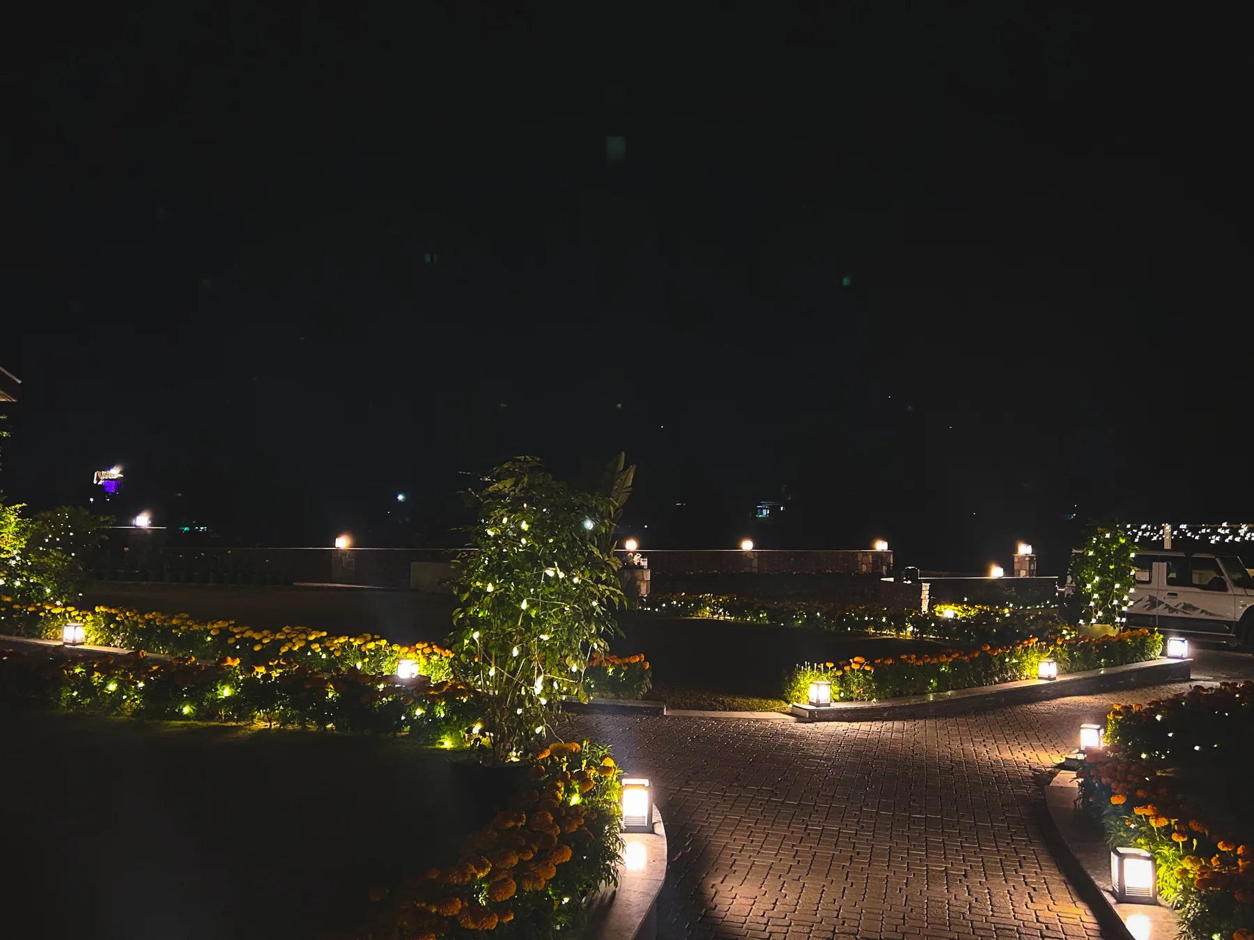 Illuminated garden pathway at the Mussoorie residence