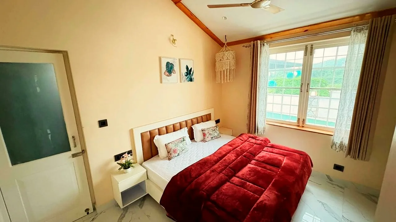 Bedroom with timber ceiling details at the Mussoorie project